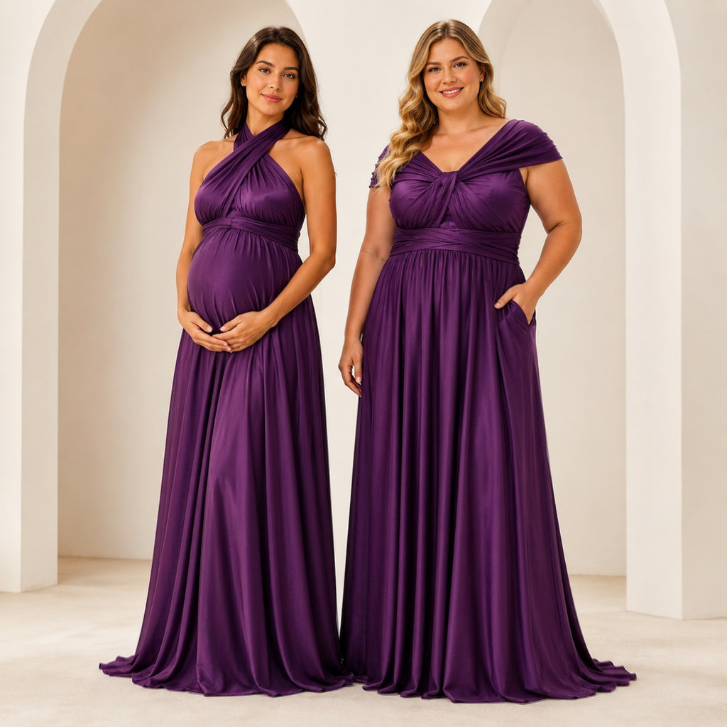 color:Grape |Two women modeling floor-length purple dresses in a bright, minimalist interior with white arches. The dress on the left is a halter-neck maternity gown with a draped bodice and flowing skirt.