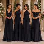 color:Black | Four bridesmaids wearing floor-length black wedding dresses with different neckline styles, standing together in a grand, sunlit courtyard with columns and floral arrangements.